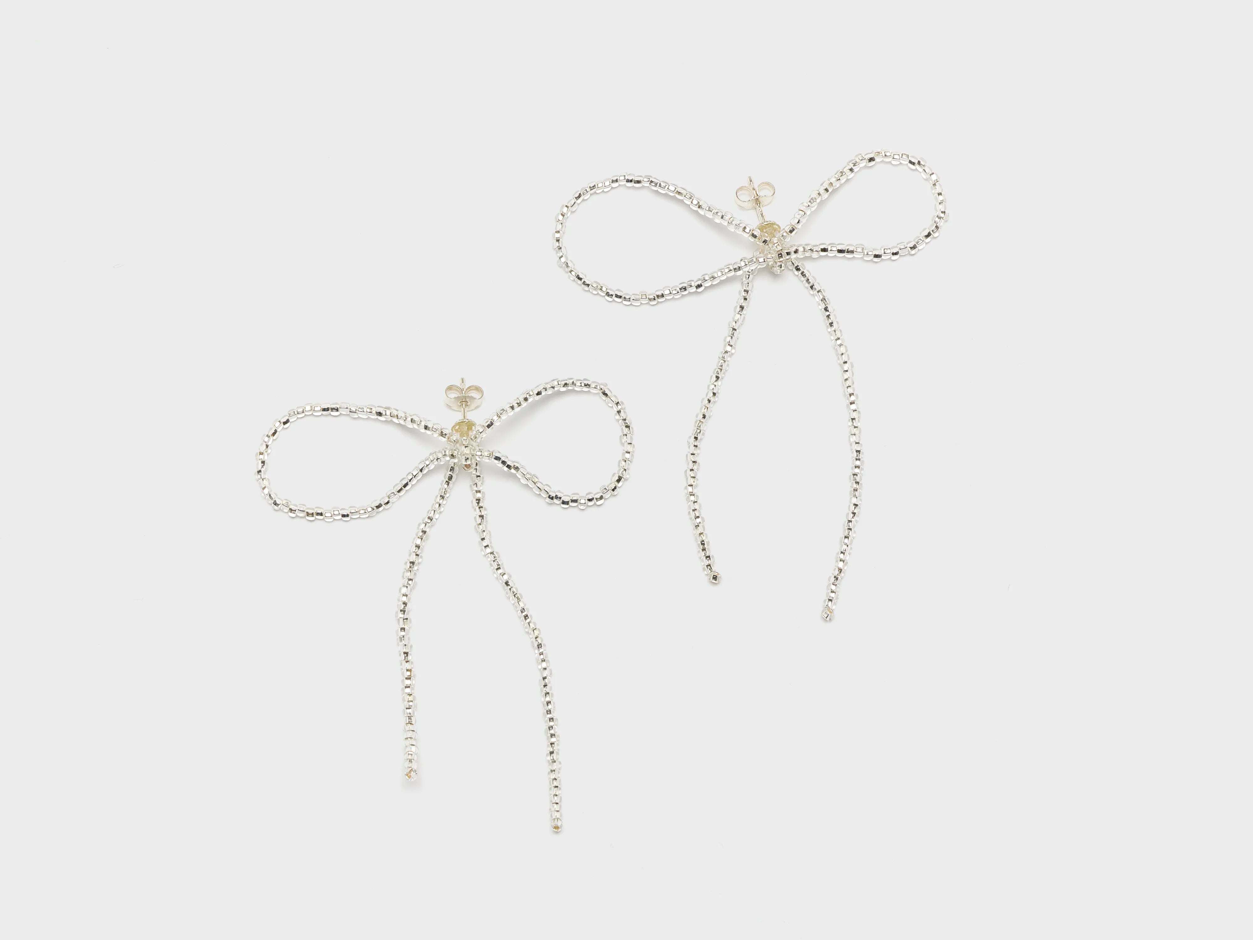Sad Bow Ear Stick Earrings  (252 / W / SILVER)